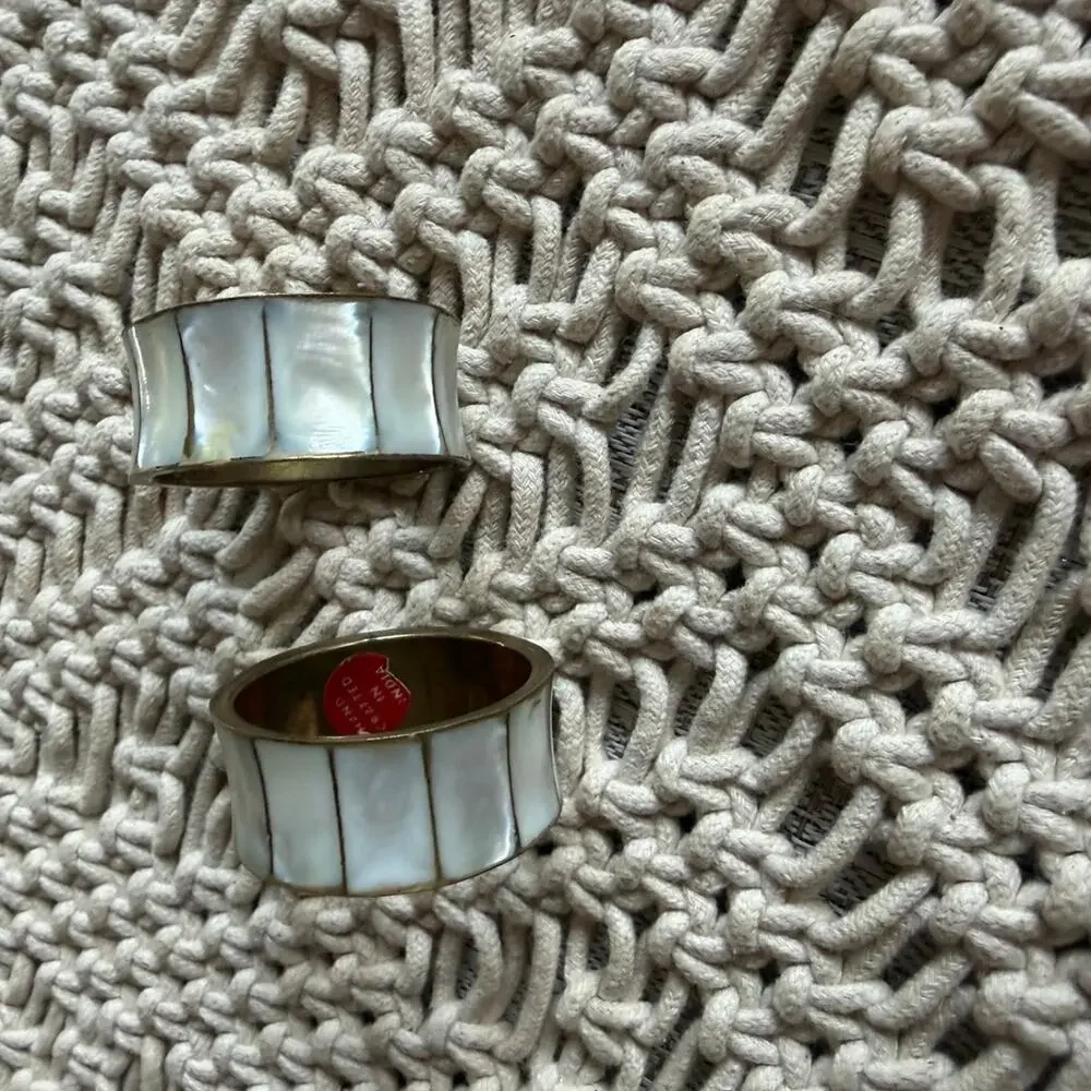 Two brass and (abalone) mother of pearl napkin rings
